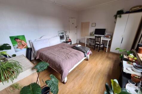 A well-lit, inviting living room with a comfort...