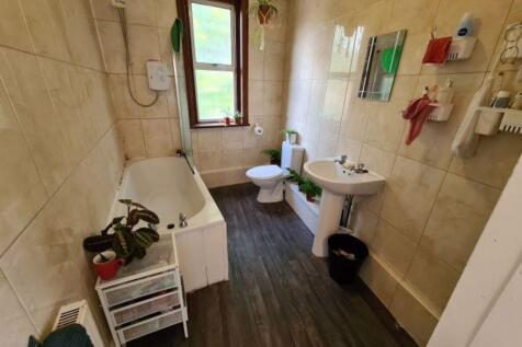 Bright and well-maintained bathroom featuring a...