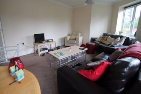 Spacious and bright living room with comfortabl...