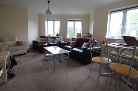 A spacious and inviting living room with ample ...