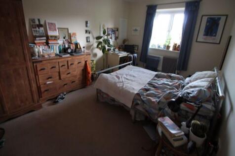 A spacious and inviting master bedroom featurin...