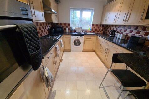 A well-maintained and brightly lit kitchen with...