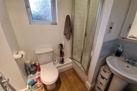 A tidy bathroom featuring a toilet and a spacio...