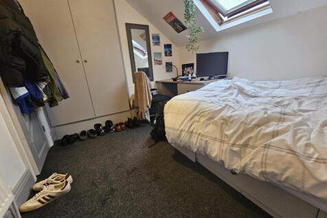 A spacious and well-maintained master bedroom f...