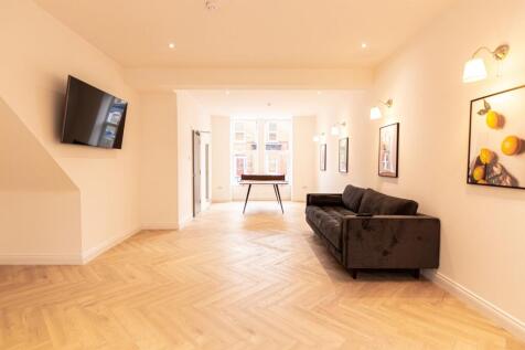 Bright and inviting living room with large wind...