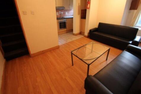 A bright and welcoming living room featuring co...