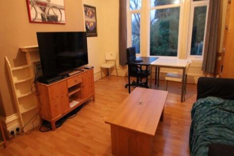 A spacious and welcoming living room featuring ...