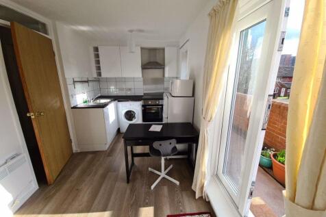 Bright and modern kitchen space featuring natur...