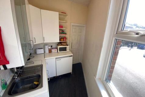 Cozy and functional kitchen area with natural l...