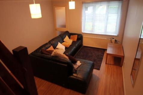 A spacious and inviting living room featuring c...