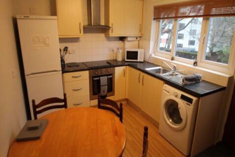 A bright and clean kitchen featuring a large wi...