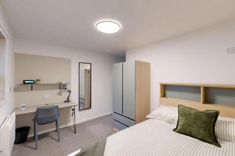 Bright, neatly presented furnished bedroom with...