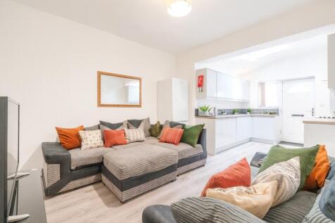 Bright and welcoming living room featuring comf...