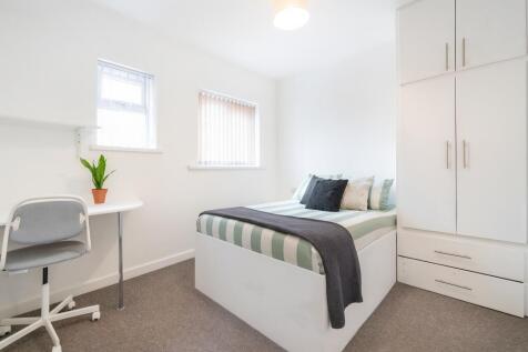 Bright and neat single bedroom featuring a comf...