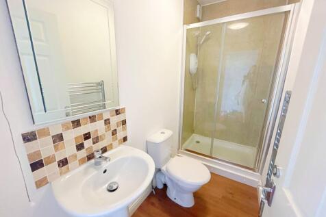 A clean and modern bathroom featuring a spaciou...