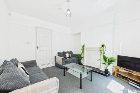 Bright and spacious living room featuring conte...