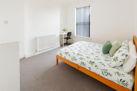 Bright and inviting double bedroom featuring a ...