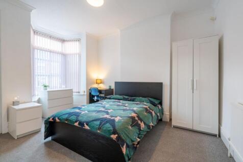 Bright and welcoming bedroom featuring a double...