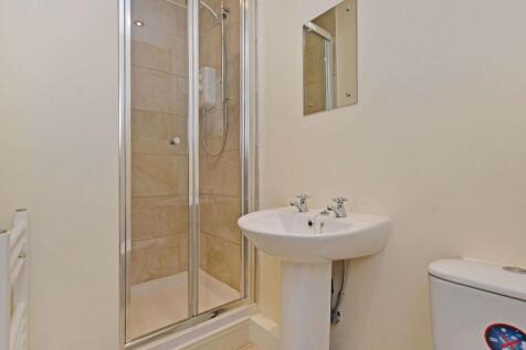 A clean and well-maintained bathroom featuring ...