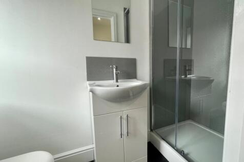 A clean and modern bathroom with minimalist fix...