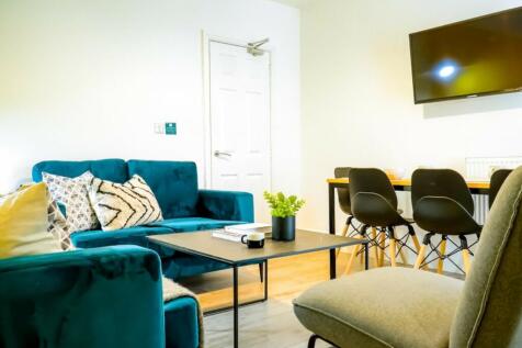 A spacious and stylish modern living room perfe...