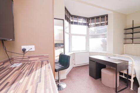 A bright and inviting double bedroom featuring ...