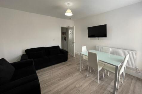 A bright and spacious modern living room featur...