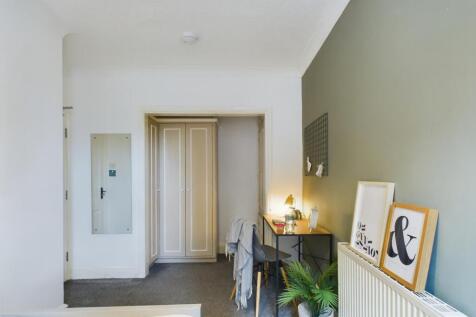 A bright and inviting double bedroom featuring ...