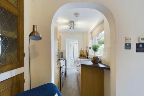 A bright and tidy kitchenette featuring modern ...