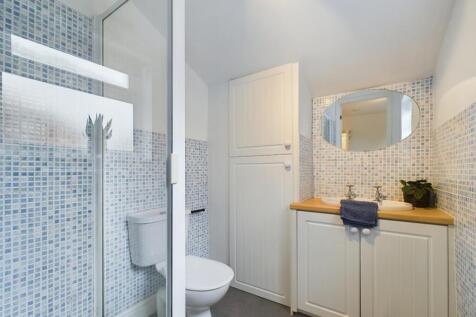 A bright and modern bathroom featuring stylish ...