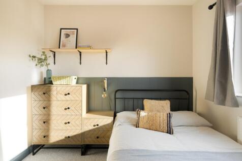 A stylish and well-decorated double bedroom wit...