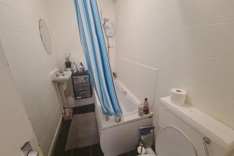 A clean and functional bathroom featuring a bat...