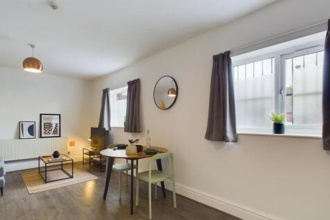 A spacious and stylish modern living room, perf...