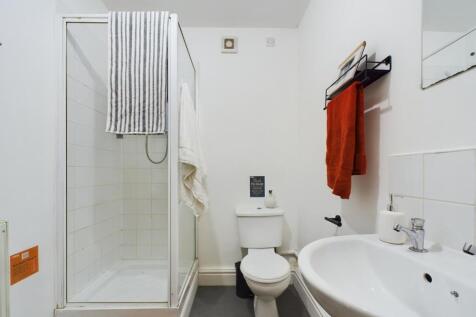 A bright and modern bathroom featuring a clean ...