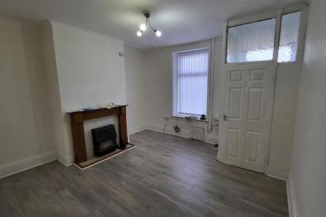 Bright, freshly decorated living room with neut...