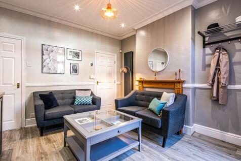 Bright and welcoming living room featuring two ...