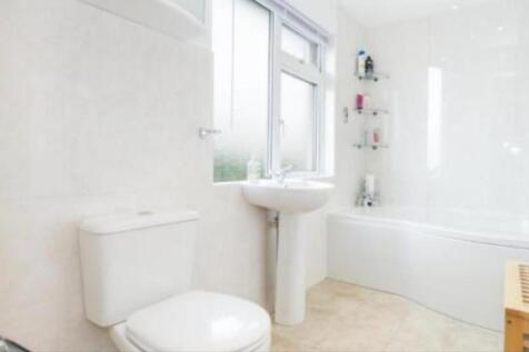 A bright and clean bathroom featuring a relaxin...