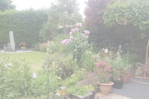 A beautifully landscaped garden filled with vib...