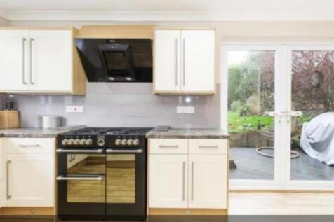 A modern and tidy kitchen featuring a stylish r...