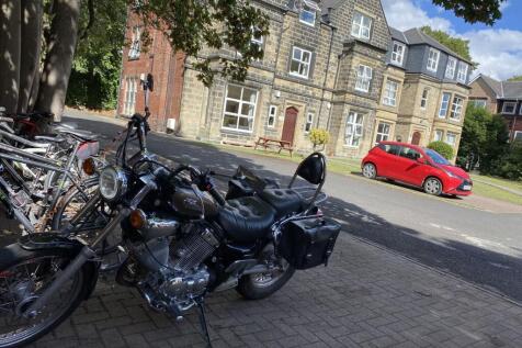 Exterior view of a historic stone building with...