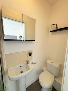 Bright, well-maintained WC with a compact pedes...