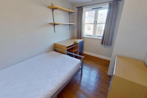 Bright, neatly presented bedroom with wooden fl...