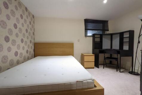 Bright, neatly presented bedroom with a modern ...