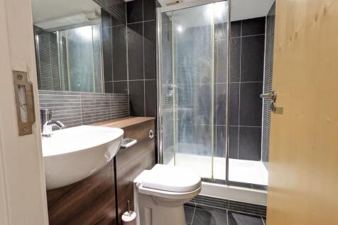 Contemporary bathroom with a walk-in shower, mo...