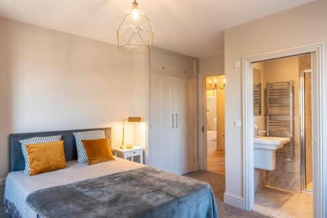 Stylish double bedroom with a comfortable uphol...