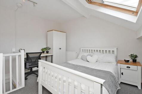 Bright attic double bedroom with a skylight, wh...