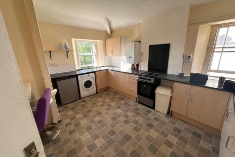 Bright, functional kitchen with plenty of count...