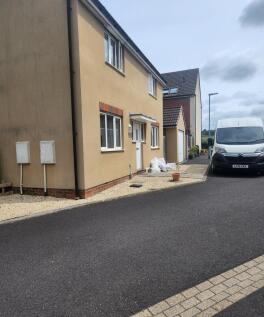 Modern semi-detached house frontage with pebble...