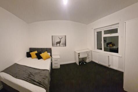 Bright, neatly presented bedroom with a double ...