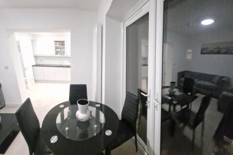 Bright open-plan living/dining area with a mode...